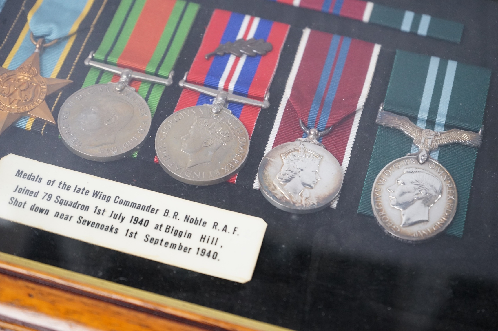 A framed WWII RAF medal group awarded to Wing Commander Brian Robert Noble, comprising;, The 1939-1945 Star, with clasp for the Battle of Britain, The Air Crew Europe Star, The Defence Medal, The British War Medal, The 1